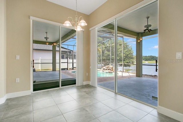 529 Quail Down Dr, Debary, FL 32713 - tiled spare room with a water view, baseboards, and a sunroom