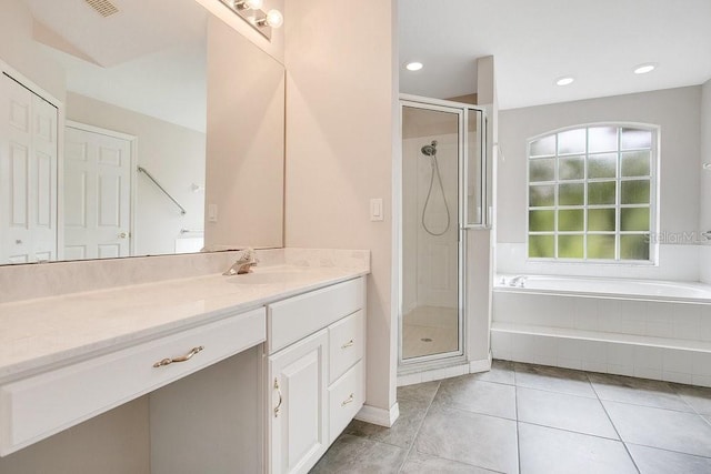 529 Quail Down Dr, Debary, FL 32713 - bathroom with a bath, vanity, a shower stall, tile patterned floors, and recessed lighting