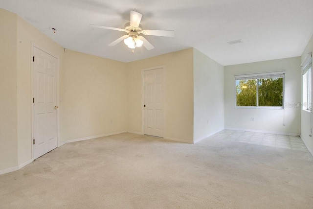 529 Quail Down Dr, Debary, FL 32713 - empty room with light colored carpet, a ceiling fan, and baseboards