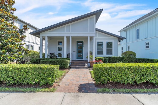 8518 Nemours Pkwy, Orlando, FL 32827 - view of front of property featuring a porch and stucco siding