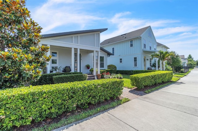 8518 Nemours Pkwy, Orlando, FL 32827 - view of front facade featuring stucco siding and covered porch