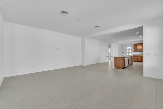8518 Nemours Pkwy, Orlando, FL 32827 - unfurnished living room featuring recessed lighting