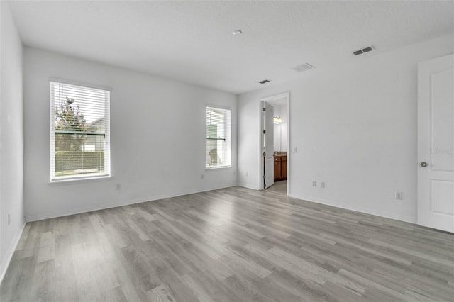 8518 Nemours Pkwy, Orlando, FL 32827 - unfurnished room featuring light wood-style floors and baseboards