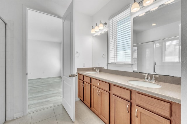 8518 Nemours Pkwy, Orlando, FL 32827 - full bath featuring double vanity, tiled shower, tile patterned floors, and plenty of natural light