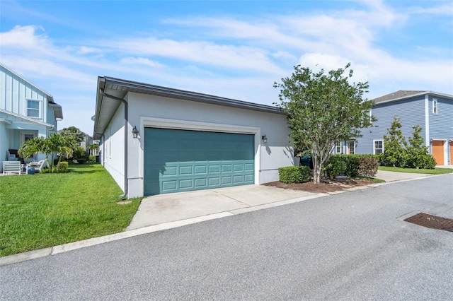 8518 Nemours Pkwy, Orlando, FL 32827 - view of front of home with concrete driveway, an attached garage, a front lawn, and stucco siding