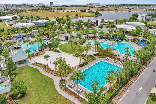8518 Nemours Pkwy, Orlando, FL 32827 - drone / aerial view of a pool and a nearby body of water