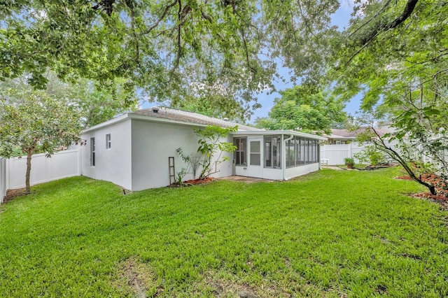 1181 Welch Hill Cir, Apopka, FL 32712 - rear view of property with a sunroom and stucco siding