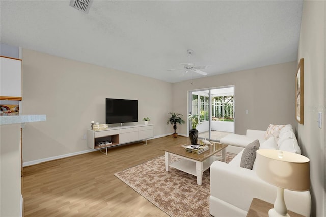1181 Welch Hill Cir, Apopka, FL 32712 - living room with a ceiling fan, wood finished floors, and baseboards