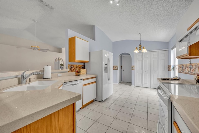 1181 Welch Hill Cir, Apopka, FL 32712 - kitchen with white appliances, lofted ceiling, a sink, arched walkways, and a ceiling fan