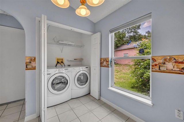 1181 Welch Hill Cir, Apopka, FL 32712 - washroom featuring washer and clothes dryer, arched walkways, and light tile patterned flooring