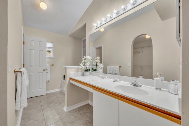 1181 Welch Hill Cir, Apopka, FL 32712 - full bath featuring vanity, a garden tub, a walk in closet, lofted ceiling, and tile patterned flooring