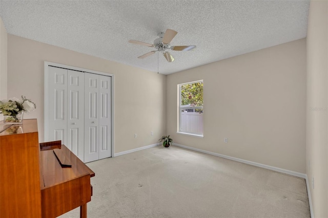 1181 Welch Hill Cir, Apopka, FL 32712 - unfurnished bedroom with carpet, a closet, a textured ceiling, baseboards, and a ceiling fan