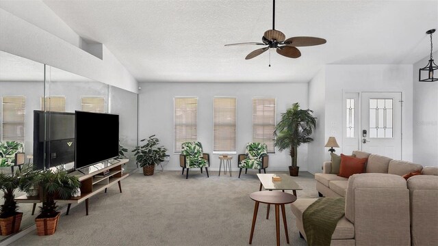 260 Coronado Dr, Punta Gorda, FL 33950 - living area featuring a ceiling fan, carpet floors, baseboards, lofted ceiling, and a textured ceiling