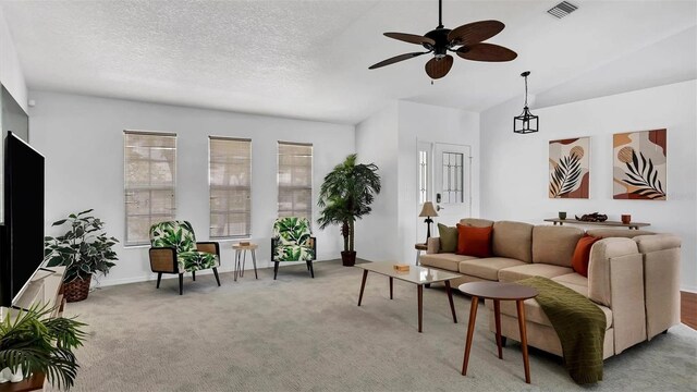260 Coronado Dr, Punta Gorda, FL 33950 - carpeted living room featuring a ceiling fan and vaulted ceiling