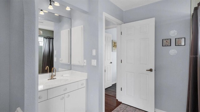 260 Coronado Dr, Punta Gorda, FL 33950 - bathroom featuring vanity, baseboards, and tile patterned flooring