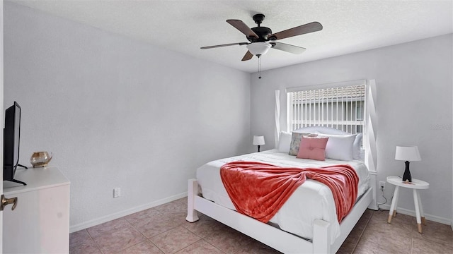 260 Coronado Dr, Punta Gorda, FL 33950 - bedroom featuring baseboards, tile patterned flooring, and ceiling fan