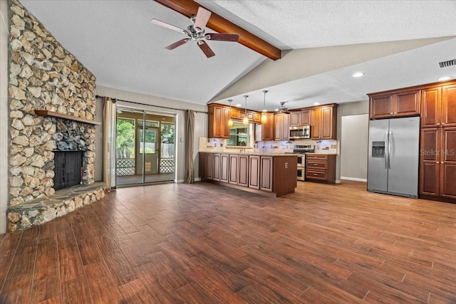 3942 Orange Lake Dr, Orlando, FL 32817 - kitchen with appliances with stainless steel finishes, a ceiling fan, dark wood-style flooring, recessed lighting, and a textured ceiling