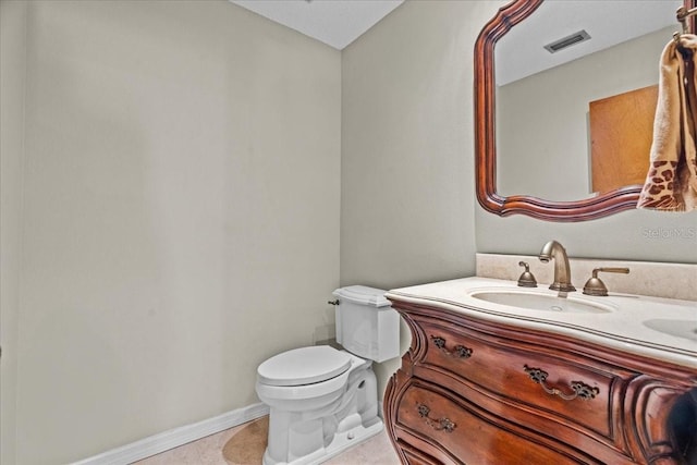 3942 Orange Lake Dr, Orlando, FL 32817 - half bath with toilet, vanity, baseboards, and tile patterned floors