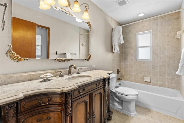 3942 Orange Lake Dr, Orlando, FL 32817 - bathroom featuring vanity, toilet, tile patterned floors, and washtub / shower combination