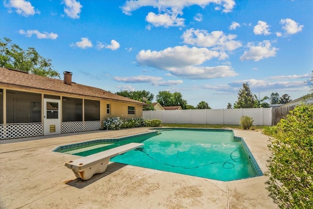 3942 Orange Lake Dr, Orlando, FL 32817 - view of swimming pool with a fenced backyard, a diving board, a sunroom, and a patio