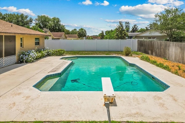 3942 Orange Lake Dr, Orlando, FL 32817 - view of swimming pool featuring a fenced backyard, a diving board, and a patio