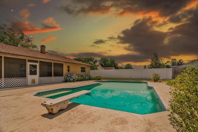 3942 Orange Lake Dr, Orlando, FL 32817 - view of swimming pool featuring a fenced backyard, a diving board, and a patio
