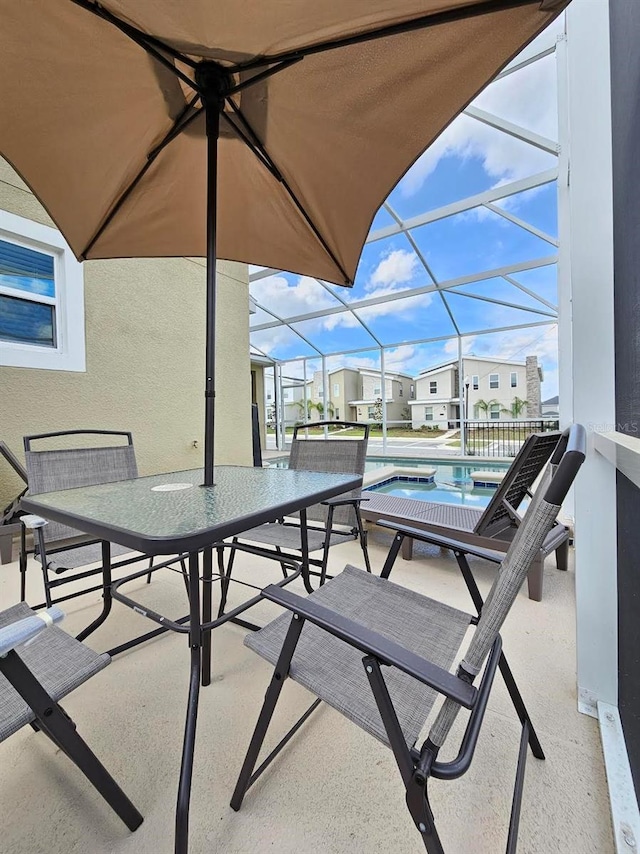 949 Leader St, Davenport, FL 33896 - view of patio / terrace with an outdoor pool, a lanai, outdoor dining area, and a residential view