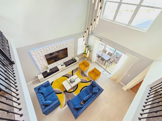 949 Leader St, Davenport, FL 33896 - living room featuring a towering ceiling, stairs, a fireplace, and baseboards