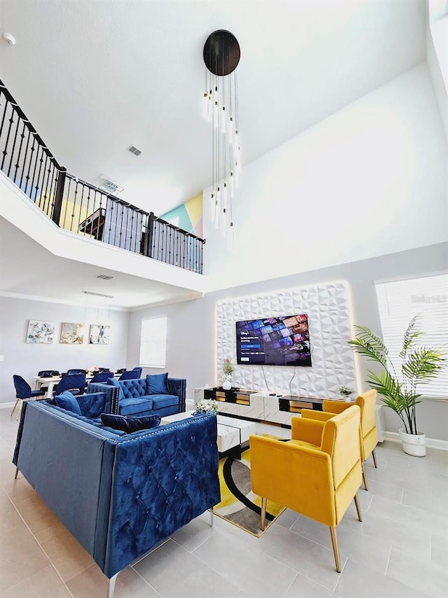 949 Leader St, Davenport, FL 33896 - living area featuring a high ceiling, tile patterned floors, and baseboards