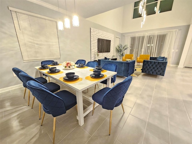 949 Leader St, Davenport, FL 33896 - dining area featuring baseboards and a towering ceiling