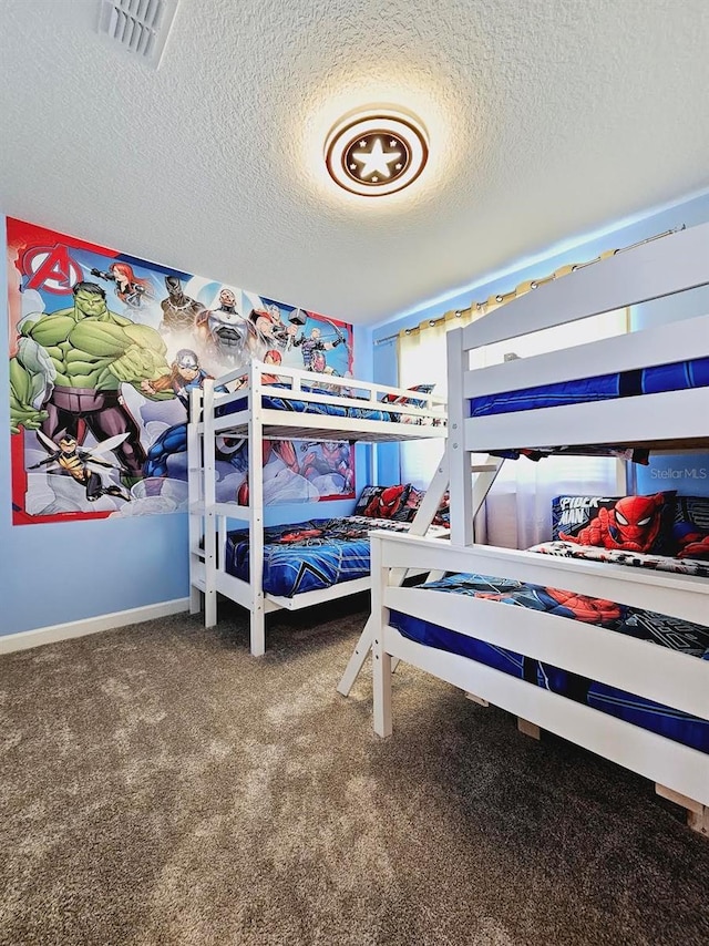 949 Leader St, Davenport, FL 33896 - carpeted bedroom featuring a textured ceiling and baseboards