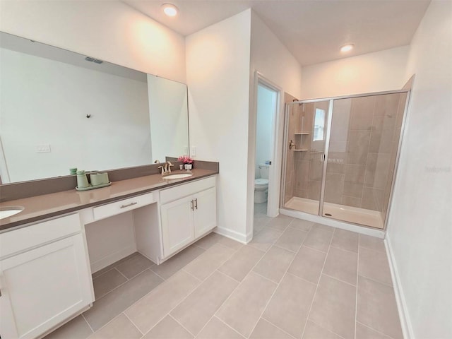 949 Leader St, Davenport, FL 33896 - full bath featuring double vanity, a shower stall, tile patterned floors, toilet, and baseboards
