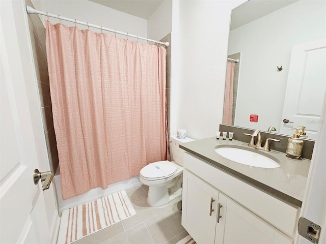 949 Leader St, Davenport, FL 33896 - bathroom with vanity, toilet, tile patterned floors, and shower / bath combination with curtain