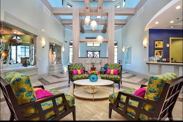 949 Leader St, Davenport, FL 33896 - living room with a towering ceiling, a chandelier, plenty of natural light, baseboards, and recessed lighting