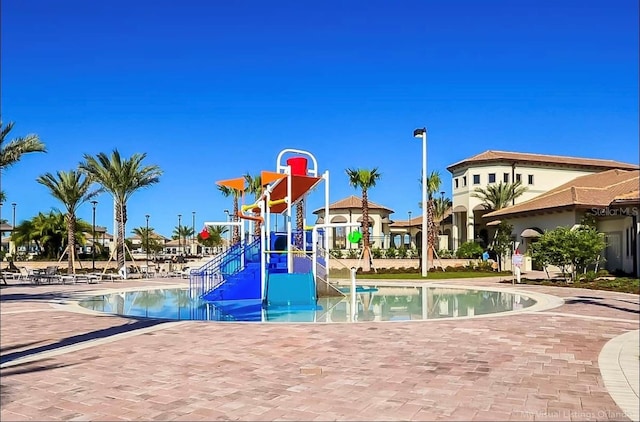 949 Leader St, Davenport, FL 33896 - community playground featuring a water play area and a community pool