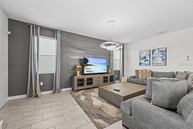8822 Interlocking Ct, Davenport, FL 33896 - living room with plenty of natural light, a chandelier, and baseboards