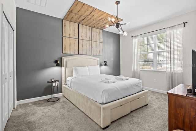 8822 Interlocking Ct, Davenport, FL 33896 - bedroom featuring baseboards, carpet, a chandelier, and a closet