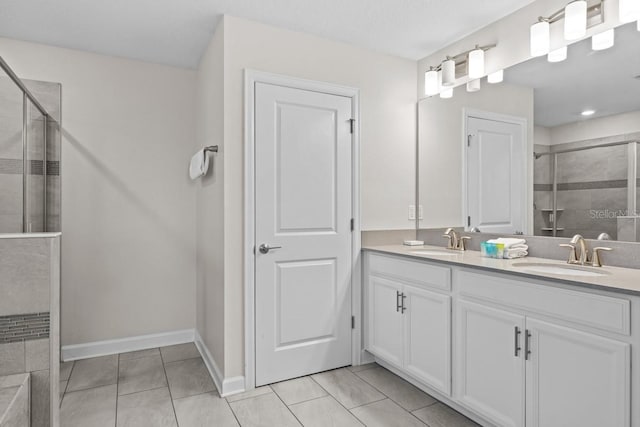 8822 Interlocking Ct, Davenport, FL 33896 - bathroom with a stall shower, double vanity, tile patterned floors, and baseboards