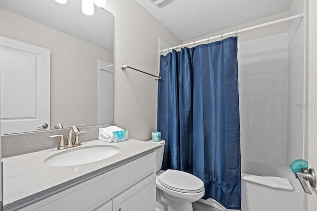 8822 Interlocking Ct, Davenport, FL 33896 - bathroom featuring vanity, toilet, shower / bath combo with shower curtain, and a textured wall