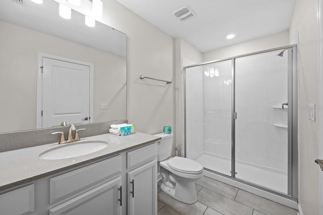8822 Interlocking Ct, Davenport, FL 33896 - full bath with vanity, toilet, a shower stall, tile patterned floors, and recessed lighting