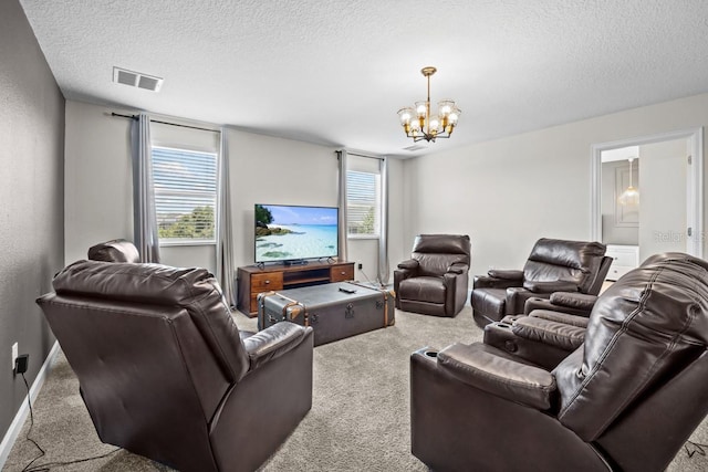 8822 Interlocking Ct, Davenport, FL 33896 - living area featuring carpet flooring, a textured ceiling, and a chandelier