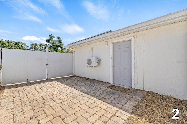 10227 Parsons St, Tampa, FL 33615 - view of patio / terrace with a cooling unit and a gate