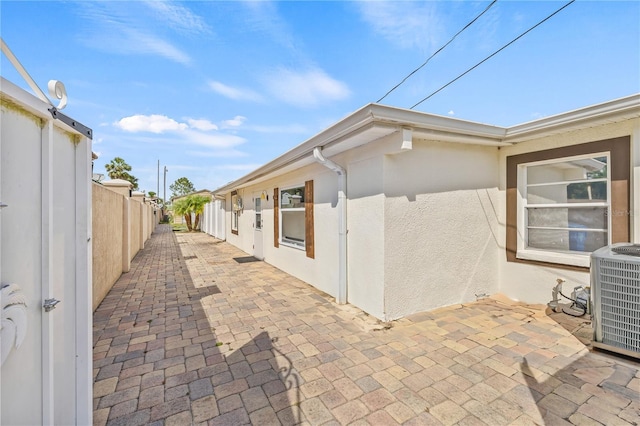 10227 Parsons St, Tampa, FL 33615 - view of patio / terrace featuring central AC unit