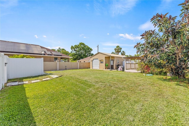 10227 Parsons St, Tampa, FL 33615 - view of yard featuring an outbuilding and a detached garage