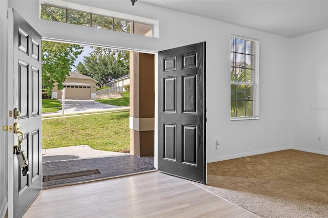 12824 Cloverdale Ln, Clermont, FL 34711 - foyer with baseboards and wood finished floors