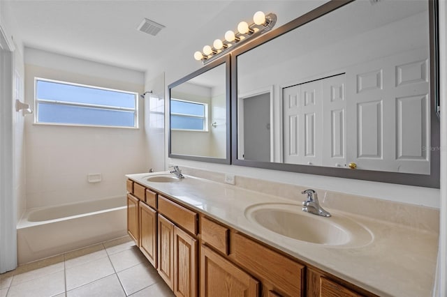 12824 Cloverdale Ln, Clermont, FL 34711 - full bath with double vanity,  shower combination, and tile patterned floors