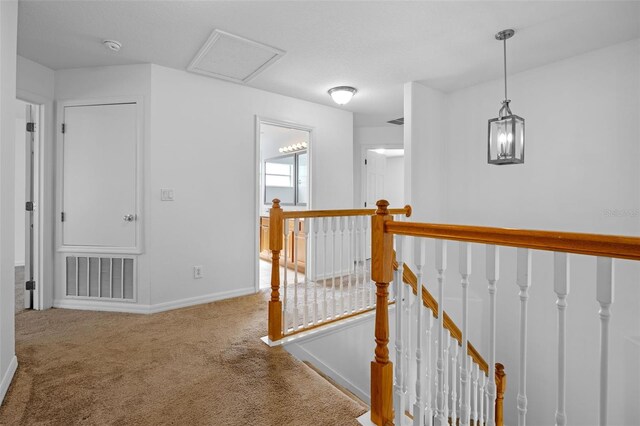 12824 Cloverdale Ln, Clermont, FL 34711 - hallway with an upstairs landing and carpet