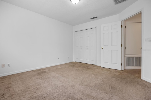 12824 Cloverdale Ln, Clermont, FL 34711 - unfurnished bedroom featuring carpet floors and a closet