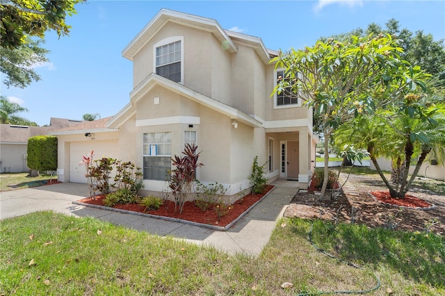 9145 Fort Jefferson Blvd, Orlando, FL 32822 - view of front of home with concrete driveway, a garage, and stucco siding