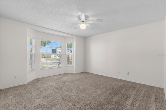 9145 Fort Jefferson Blvd, Orlando, FL 32822 - carpeted empty room featuring a textured ceiling, a ceiling fan, and baseboards